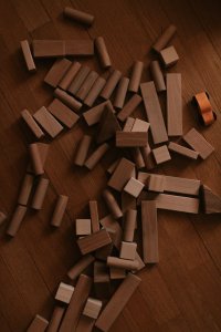 scattered wooden blocks on wooden floor
