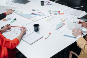 office supplies and paperwork on a white desk